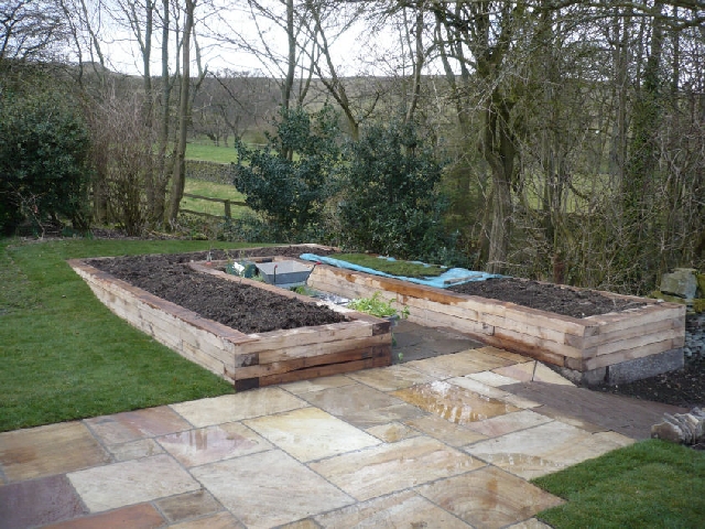 Raised Oak Planters Replace the Existing Vegatable Garden.