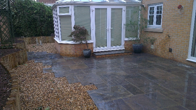 Indian Sandstone Paving. (Borderstone Twilight) with Log Planter