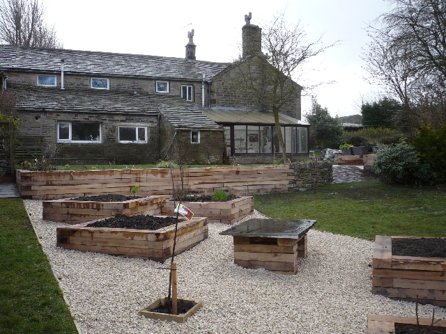 oak raised planters and gravel